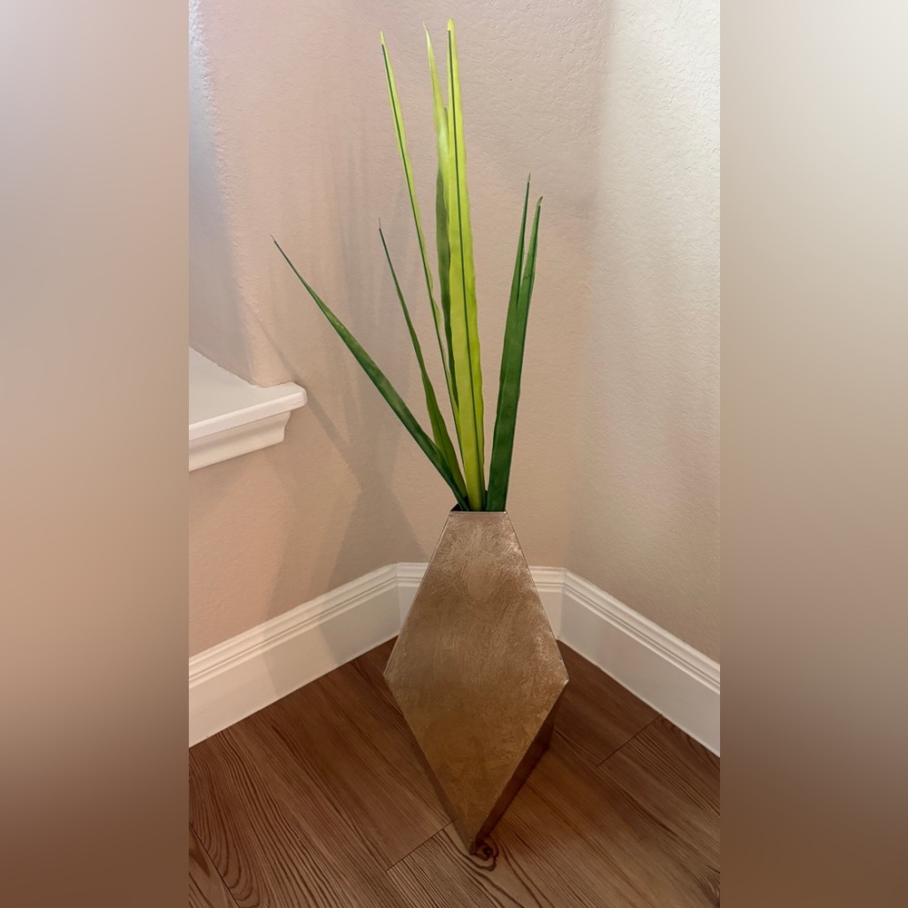 Gold geometric vase and fake palm from pier1 imports.